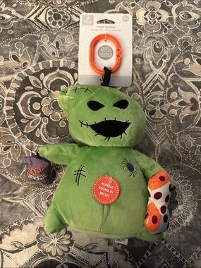 NWT- Disney Green Oogie Boogie Plush Rattle with Orange Polka-Dot Arm ages 0+
